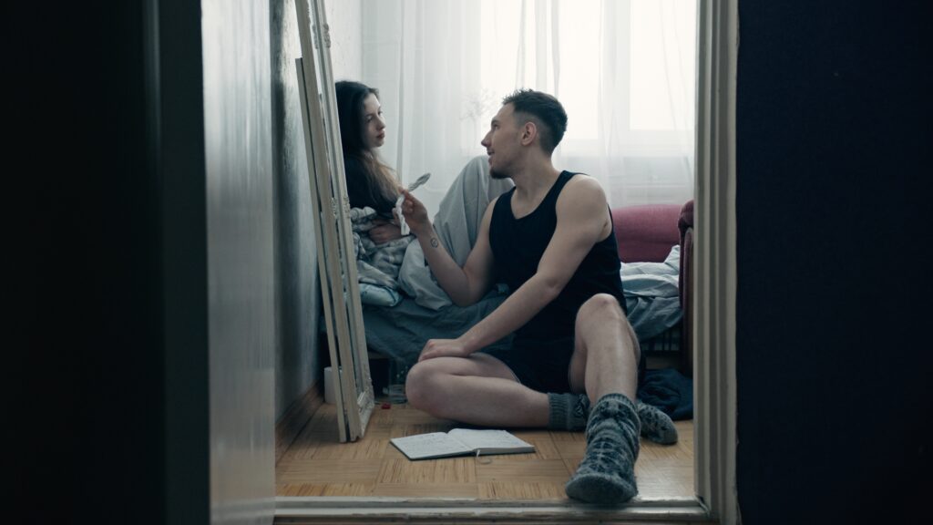 Screencap from the movie You Shouldn't Play Alone, displaying the cold and desolated environment of winter Estonia in the Russian comunity, and the life of Anna and Jevgeny and their troubled relationship