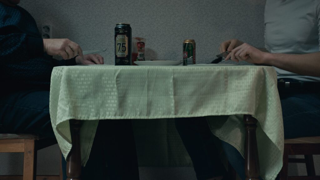 Screencap from the movie You Shouldn't Play Alone, displaying the cold and desolated environment of winter Estonia in the Russian comunity, and the life of Anna and Jevgeny and their troubled relationship