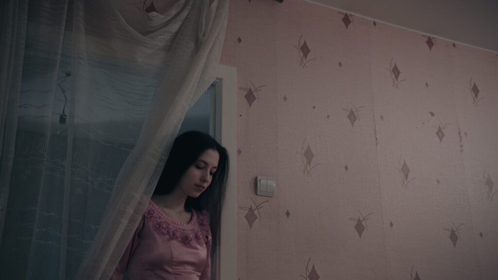 Screencap from the movie You Shouldn't Play Alone, displaying the cold and desolated environment of winter Estonia in the Russian comunity, and the life of Anna and Jevgeny and their troubled relationship